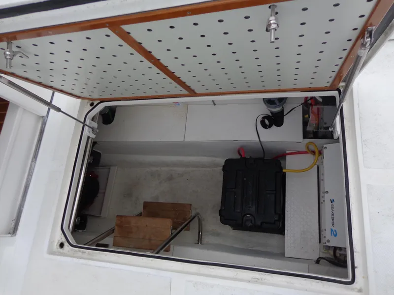 Slide: The Image of Open hatch of 2020 SeaPiper Pilothouse showing interior storage and equipment. - 32