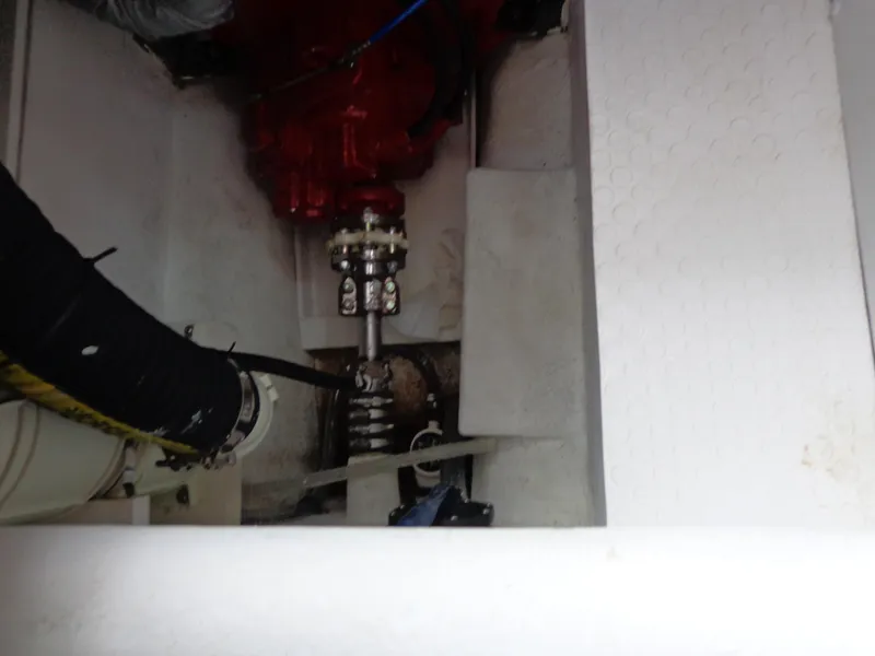 Slide: The Image of Engine compartment of 2020 SeaPiper Pilothouse boat, showing mechanical components and piping. - 37