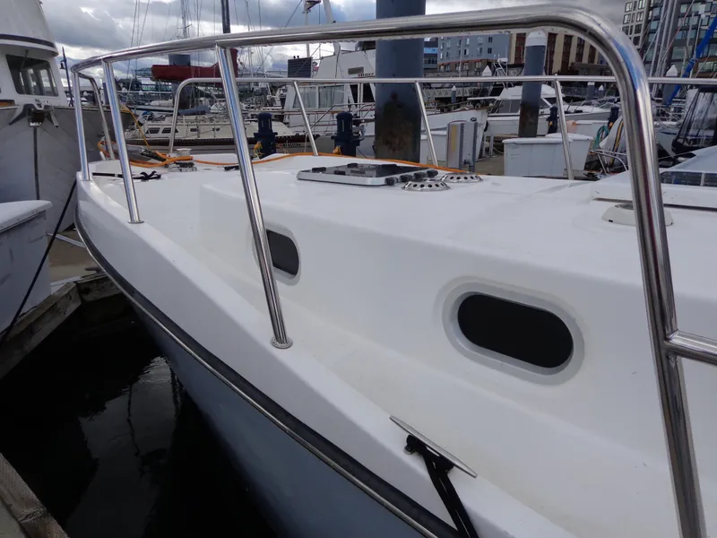 Slide: The Image of 2020 SeaPiper Pilothouse boat docked at marina, featuring sleek white design and stainless steel railings. - 41