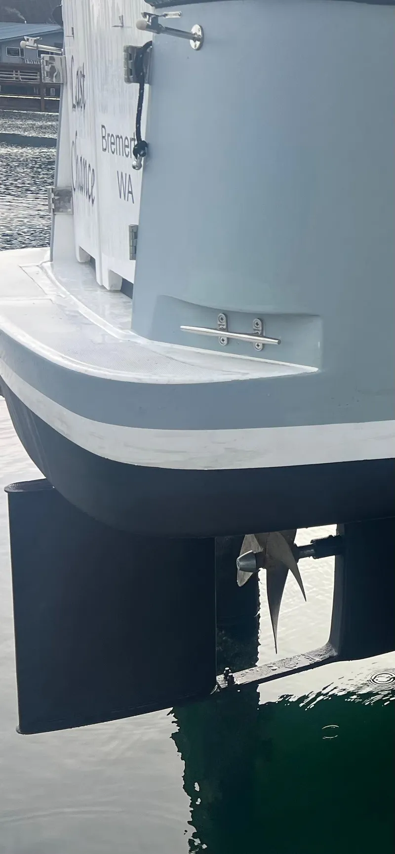 Slide: The Image of 2020 SeaPiper Pilothouse boat stern with visible propeller and rudder in marina. - 47