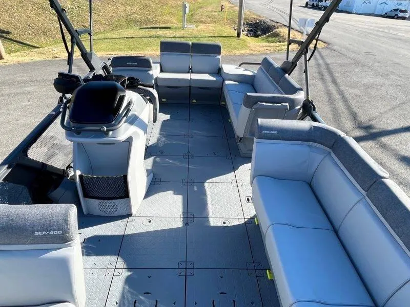 Slide: The Image of 2024 Sea-Doo Switch Cruise 21' 230HP pontoon boat interior with spacious seating. - 21