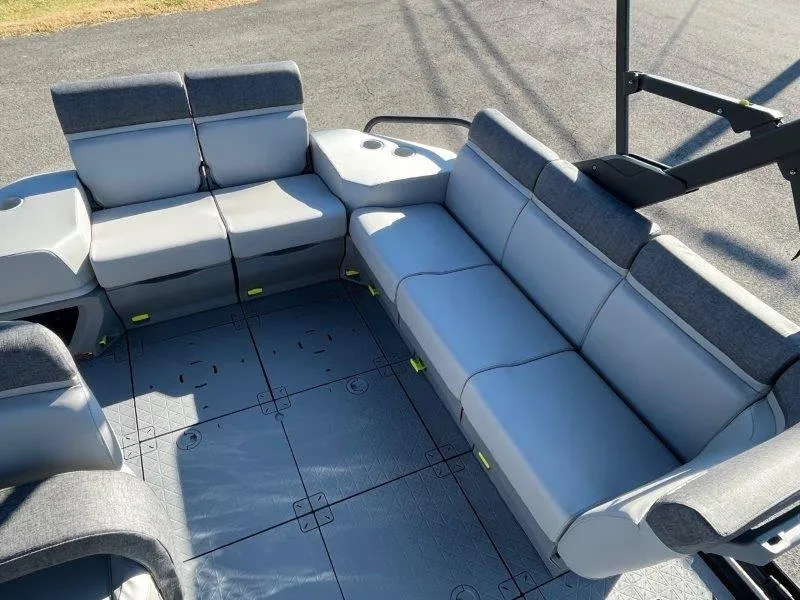 Slide: The Image of 2024 Sea-Doo Switch Cruise 21' 230HP interior seating area with gray upholstery. - 23