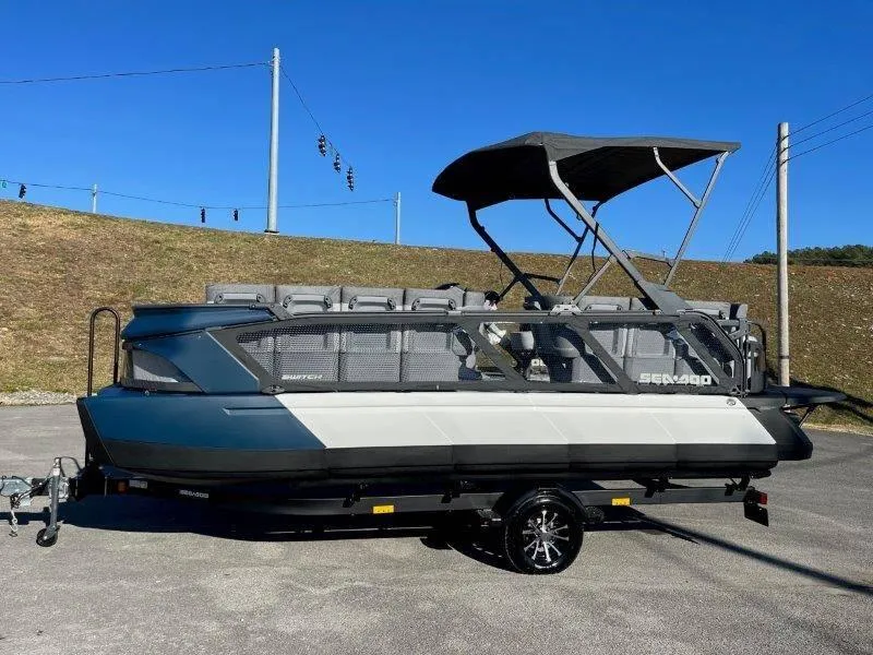 Slide: The Image of 2024 Sea-Doo Switch Cruise 21' 230HP pontoon boat with canopy on trailer. - 3