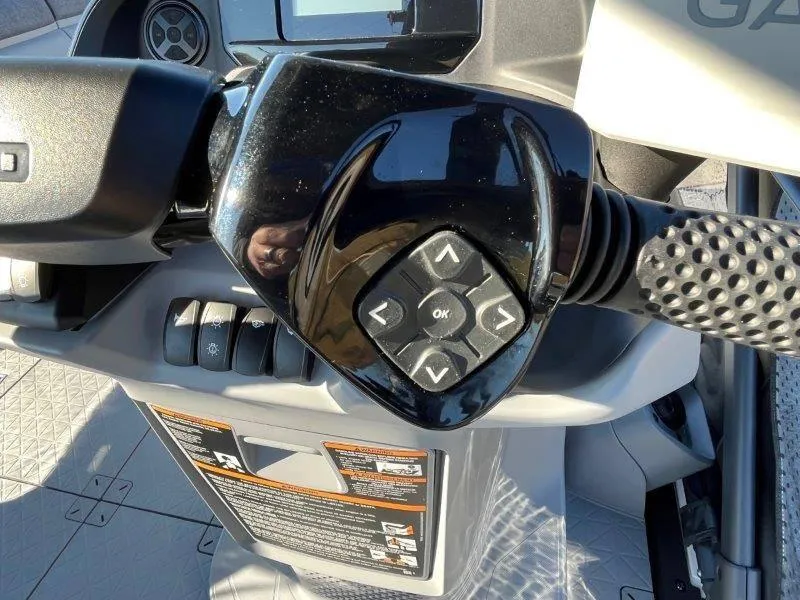 Slide: The Image of Close-up of 2024 Sea-Doo Switch Cruise 21' 230HP steering controls. - 30