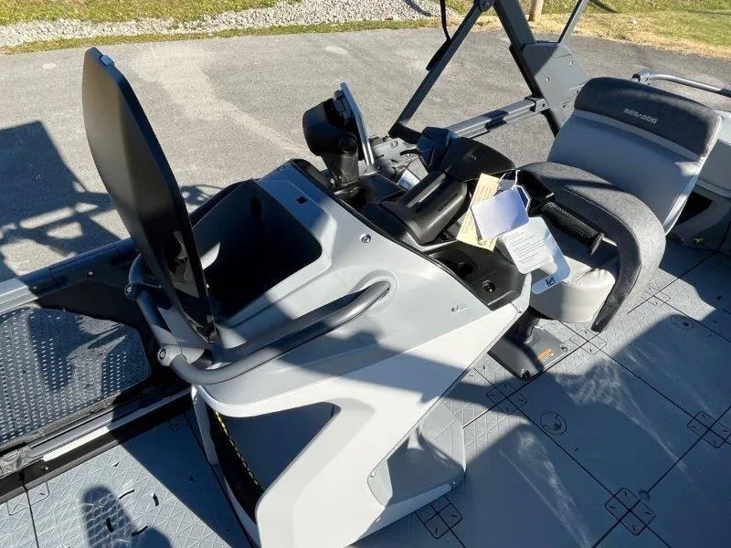 Slide: The Image of 2024 Sea-Doo Switch Cruise 21' 230HP dashboard and seating area, outdoor view. - 31
