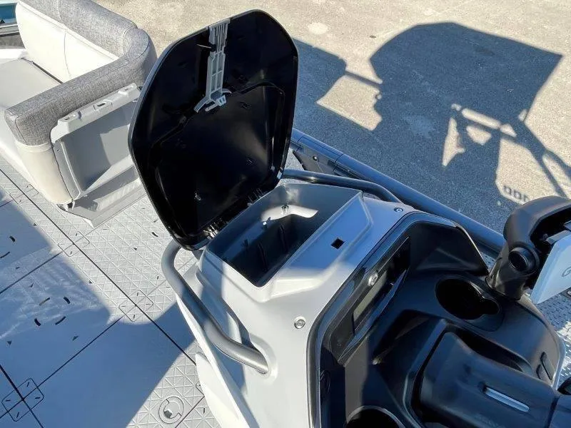 Slide: The Image of 2024 Sea-Doo Switch Cruise 21' 230HP interior with open storage compartment. - 36