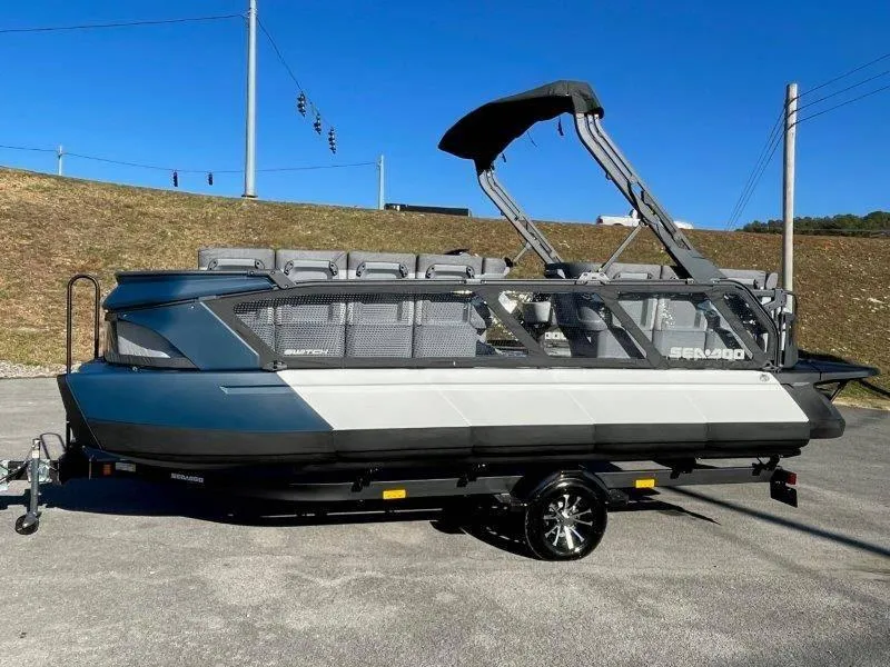 Slide: The Image of 2024 Sea-Doo Switch Cruise 21' 230HP pontoon boat on trailer, side view. - 37