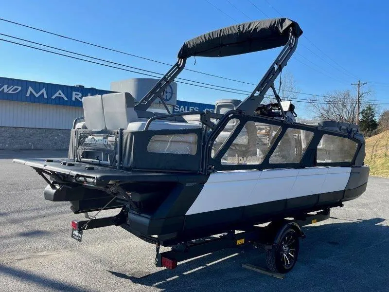 Slide: The Image of 2024 Sea-Doo Switch Cruise 21' 230HP pontoon boat on trailer, parked outdoors. - 39