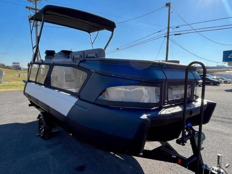Slide: The Image of 2024 Sea-Doo Switch Cruise 21' 230HP pontoon boat on trailer, parked outdoors. - 4
