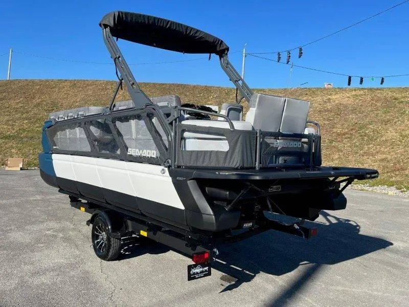 Slide: The Image of 2024 Sea-Doo Switch Cruise 21' 230HP pontoon boat on trailer, outdoor setting. - 40