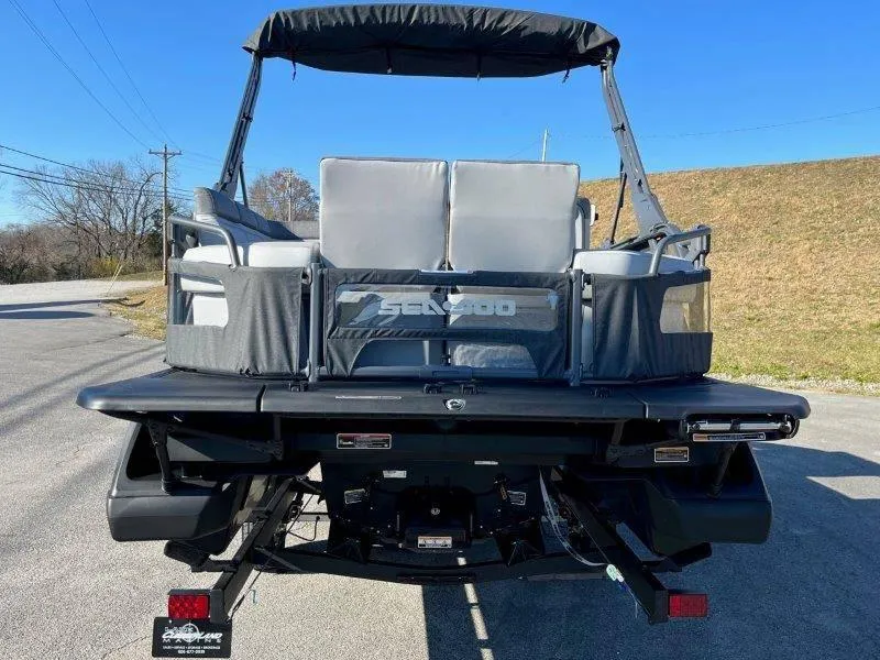 Slide: The Image of 2024 Sea-Doo Switch Cruise 21' 230HP pontoon boat, rear view on trailer. - 41