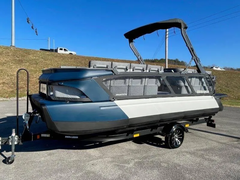 Slide: The Image of 2024 Sea-Doo Switch Cruise 21' 230HP pontoon boat on trailer, parked outdoors. - 47