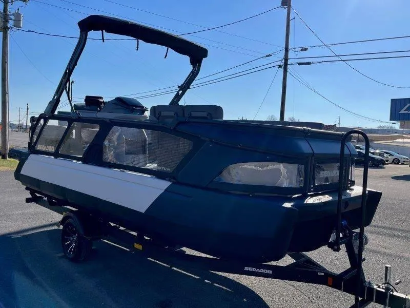 Slide: The Image of 2024 Sea-Doo Switch Cruise 21' 230HP boat on trailer, parked outdoors. - 48
