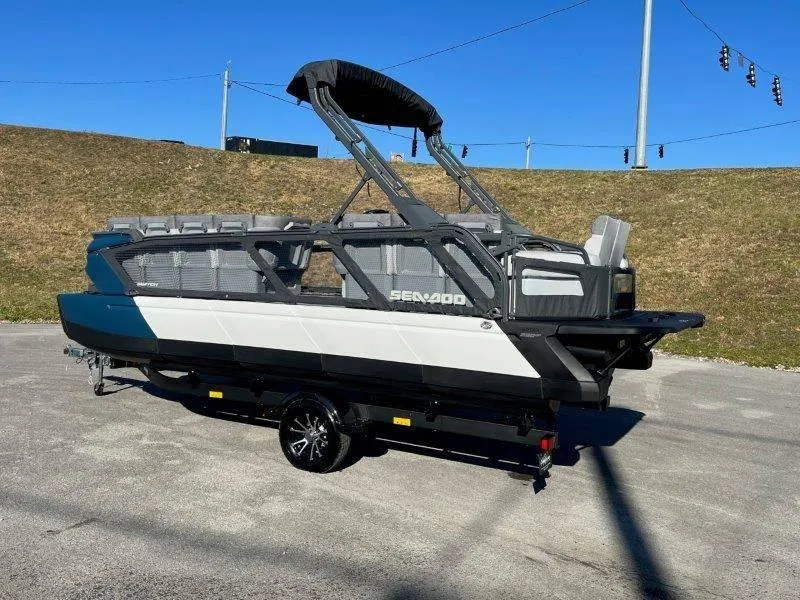 Slide: The Image of 2024 Sea-Doo Switch Cruise 21' 230HP boat on trailer, parked outdoors. - 49