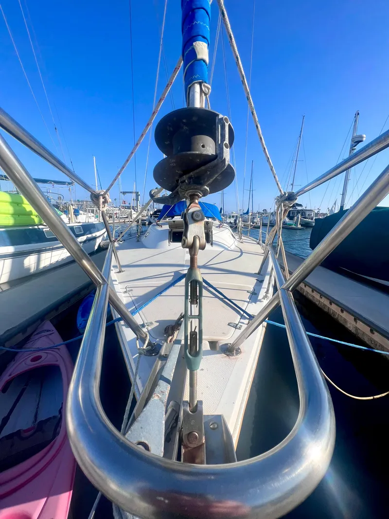 Slide: The Image of 1983 Catalina 36 sailboat deck view with rigging in a marina. - 7
