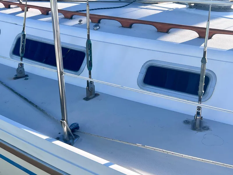 Slide: The Image of 1983 Catalina 36 sailboat deck with windows and railing. - 9