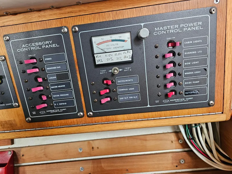 Slide: The Image of Control panels on a 1987 Express 37 boat with switches and meter. - 14