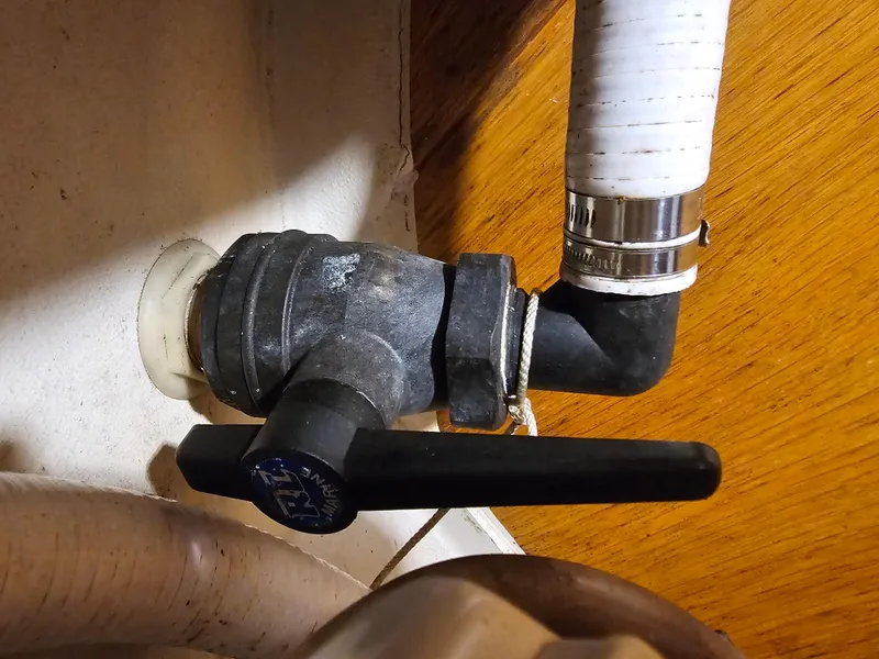 Slide: The Image of Boat plumbing valve with attached hose, Express 37, 1987 model. - 17