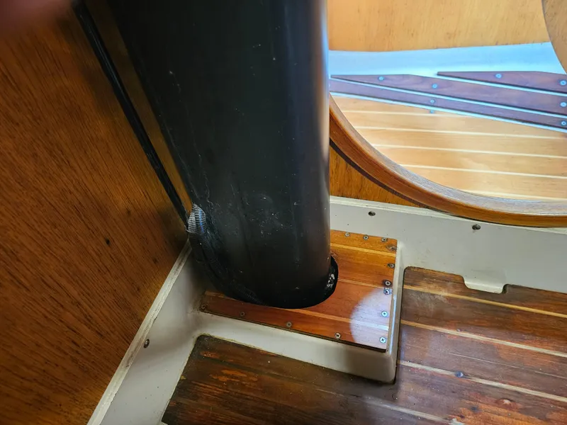 Slide: The Image of Interior view of 1987 Express 37 sailboat mast base and wooden flooring. - 18