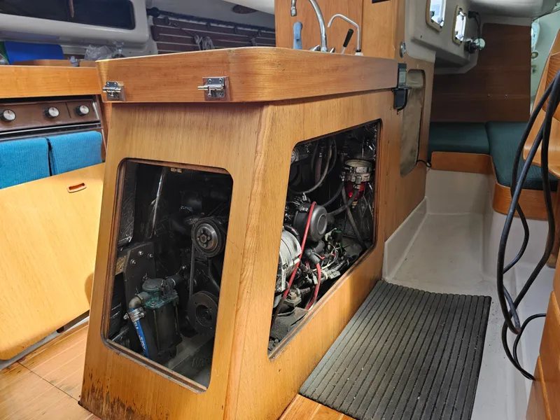 Slide: The Image of Engine compartment of a 1987 Express 37 sailboat, showcasing interior details and components. - 22