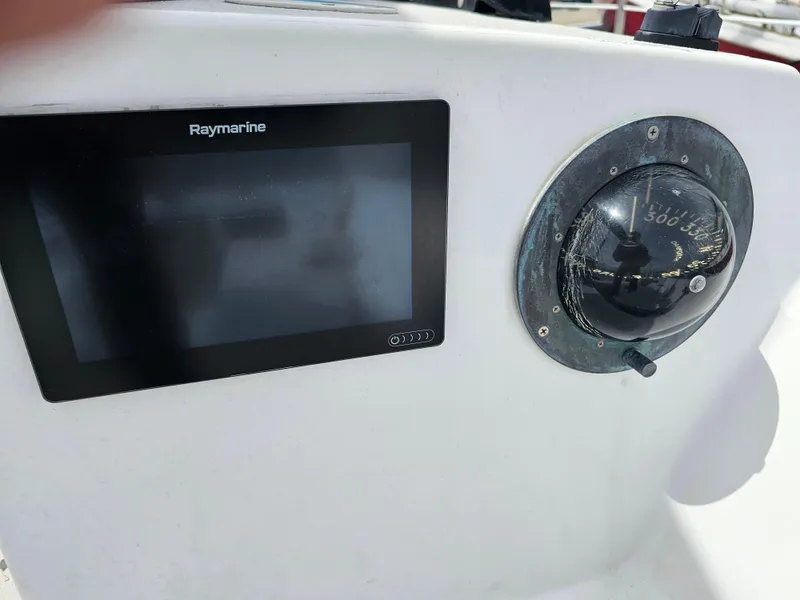 Slide: The Image of Raymarine navigation display and compass on 1987 Express 37 yacht. - 6