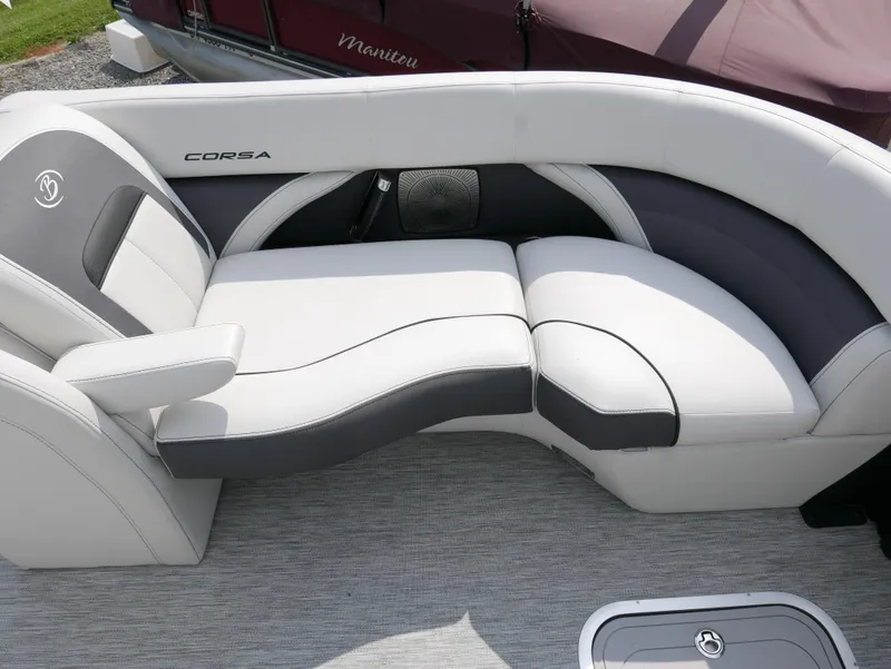 Slide: The Image of 2022 Barletta Corsa 23UC boat interior with stylish white and gray seating. - 11