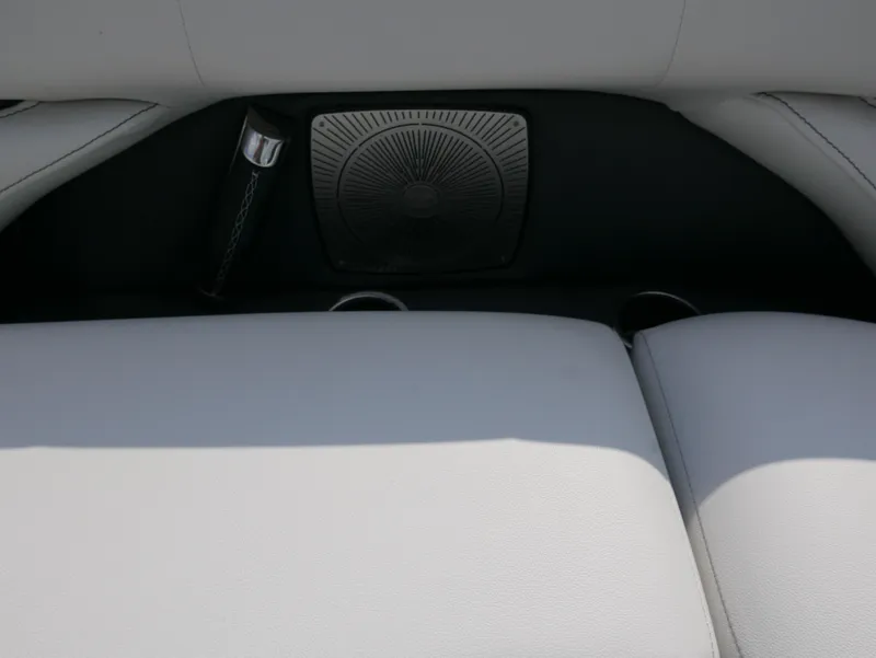 Slide: The Image of Interior of 2022 Barletta Corsa 23UC with white seating and speaker detail. - 12