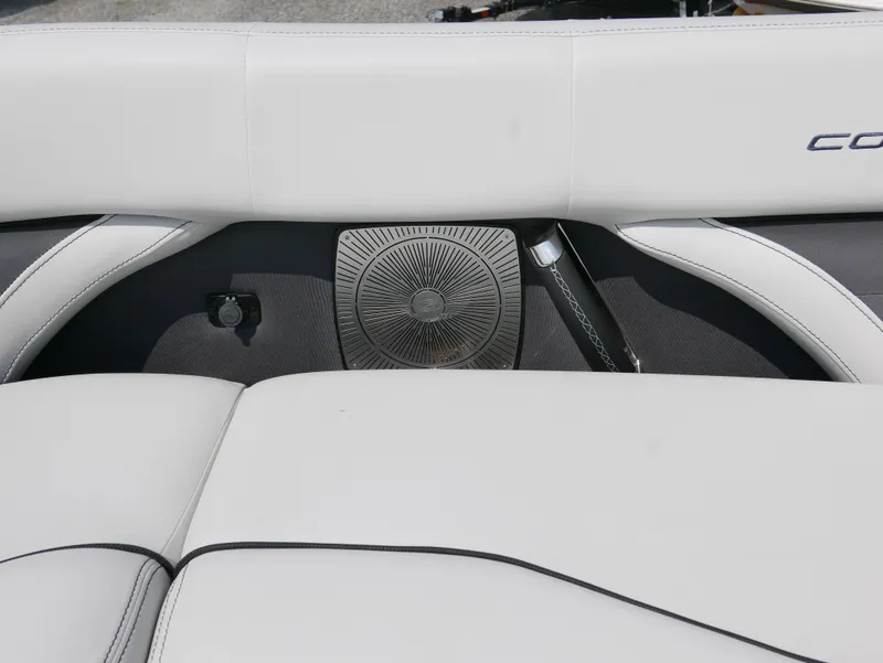Slide: The Image of 2022 Barletta Corsa 23UC boat interior with white seating and speaker detail. - 14