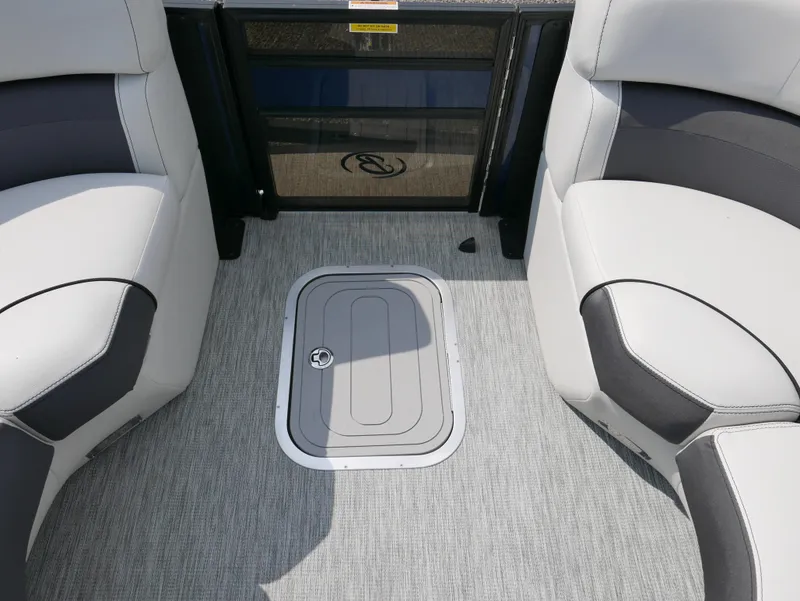 Slide: The Image of 2022 Barletta Corsa 23UC boat interior with gray flooring and cushioned seating. - 15