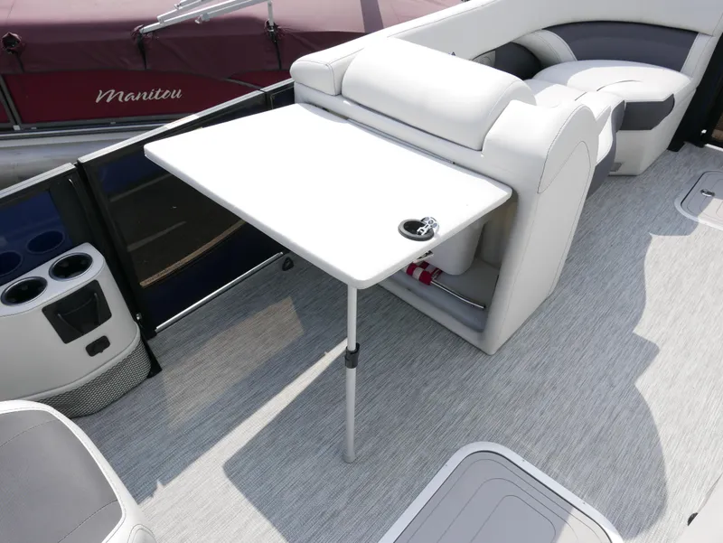 Slide: The Image of 2022 Barletta Corsa 23UC boat interior with table and seating area. - 19