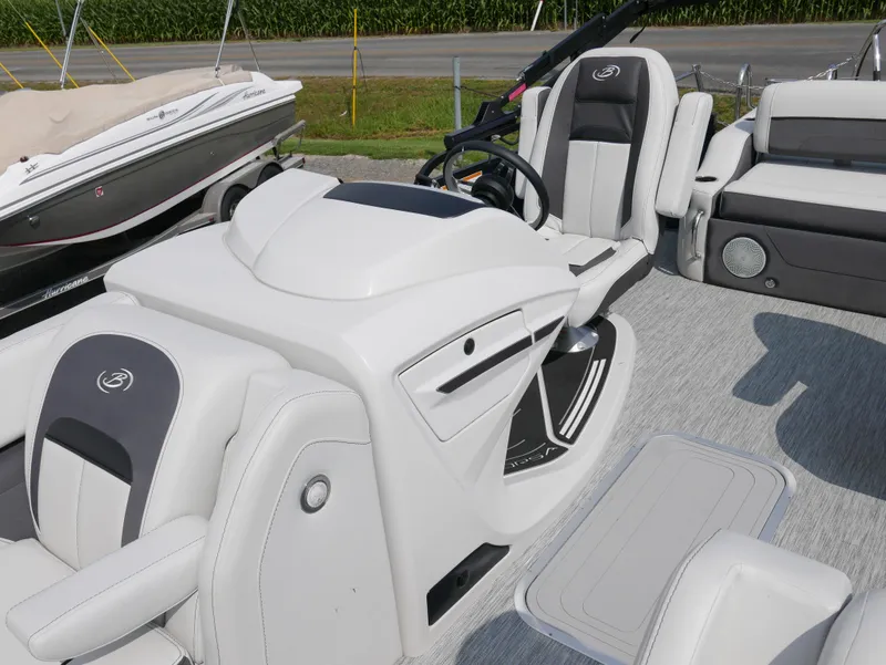 Slide: The Image of 2022 Barletta Corsa 23UC boat interior with modern seating and steering console. - 20