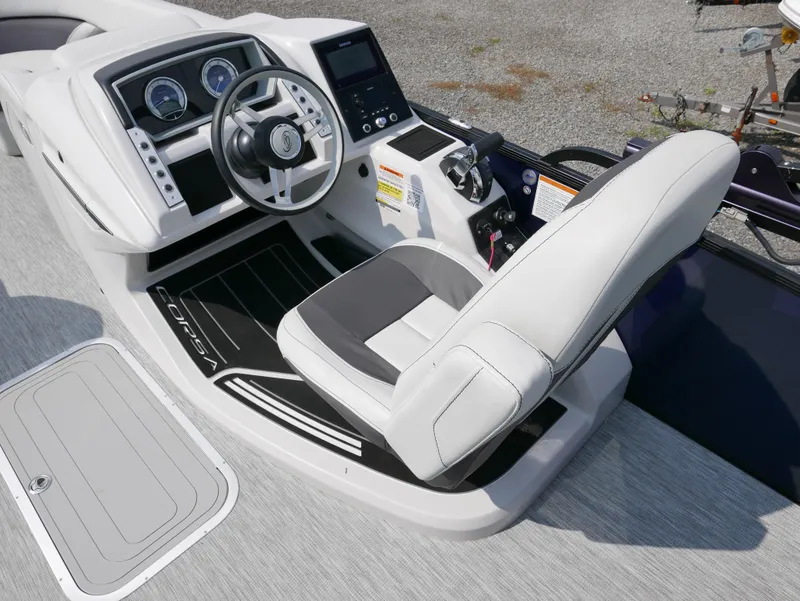 Slide: The Image of 2022 Barletta Corsa 23UC boat cockpit with modern steering and controls. - 21