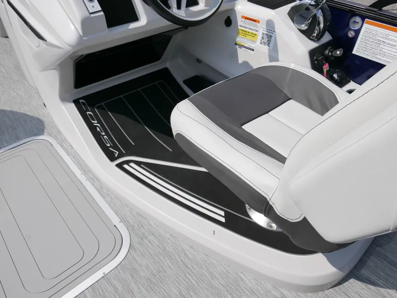 Slide: The Image of 2022 Barletta Corsa 23UC boat interior with sleek seating and modern dashboard design. - 26