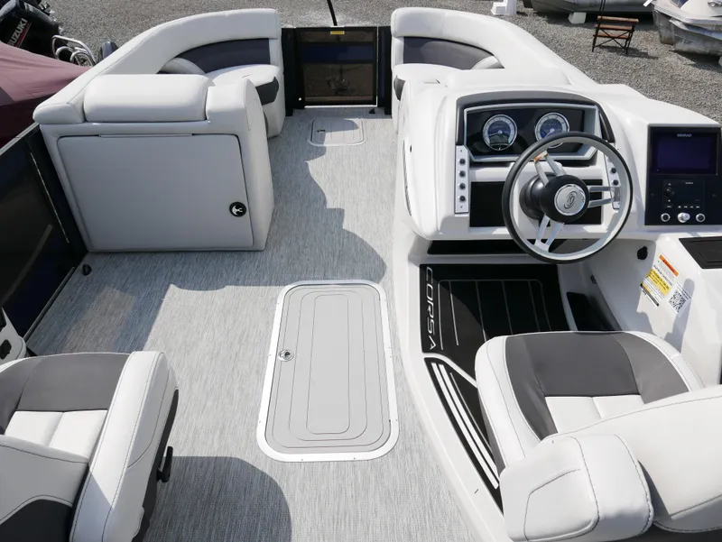Slide: The Image of 2022 Barletta Corsa 23UC boat interior with modern steering and seating. - 27