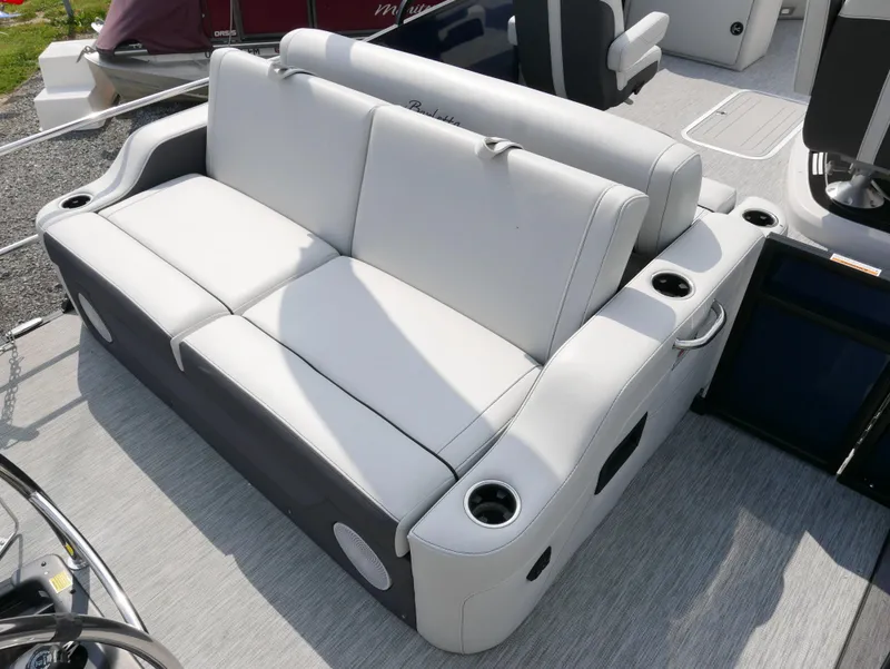 Slide: The Image of 2022 Barletta Corsa 23UC boat interior with plush seating and cup holders. - 30