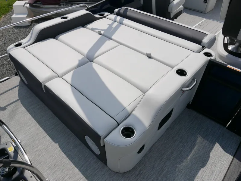 Slide: The Image of 2022 Barletta Corsa 23UC boat seating with cup holders, featuring sleek gray upholstery. - 34