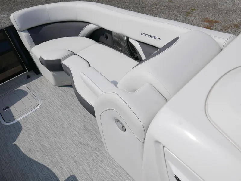 Slide: The Image of 2022 Barletta Corsa 23UC boat interior with sleek white seating and modern design. - 9
