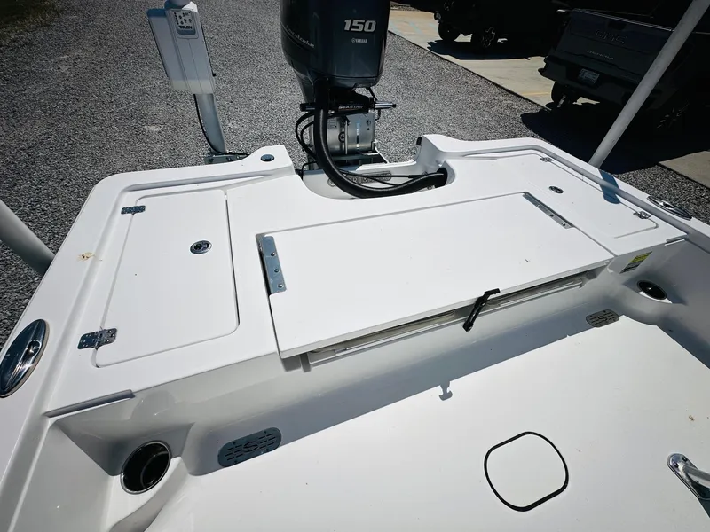 Slide: The Image of 2021 Sportsman Tournament 214 SBX Bay Boat with 150 HP engine, rear deck view. - 11