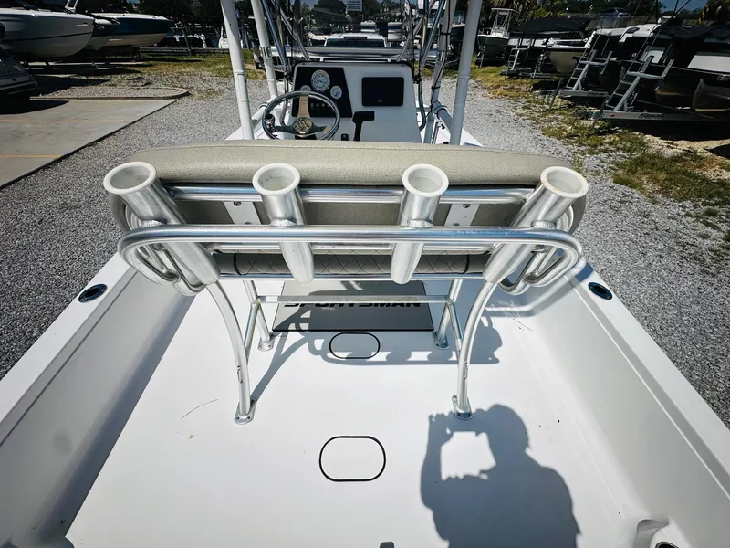Slide: The Image of 2021 Sportsman Tournament 214 SBX Bay Boat interior with rod holders and console. - 13