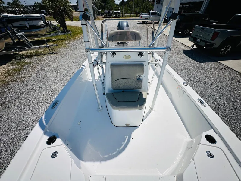 Slide: The Image of 2021 Sportsman Tournament 214 SBX Bay Boat, white deck, center console, outdoor setting. - 20