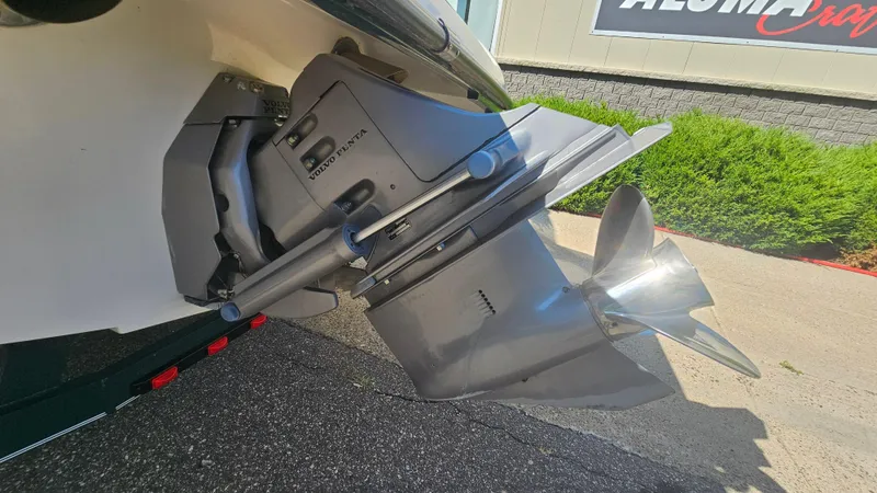 Slide: The Image of 2001 Reinell 240 C boat outdrive and propeller close-up. - 22