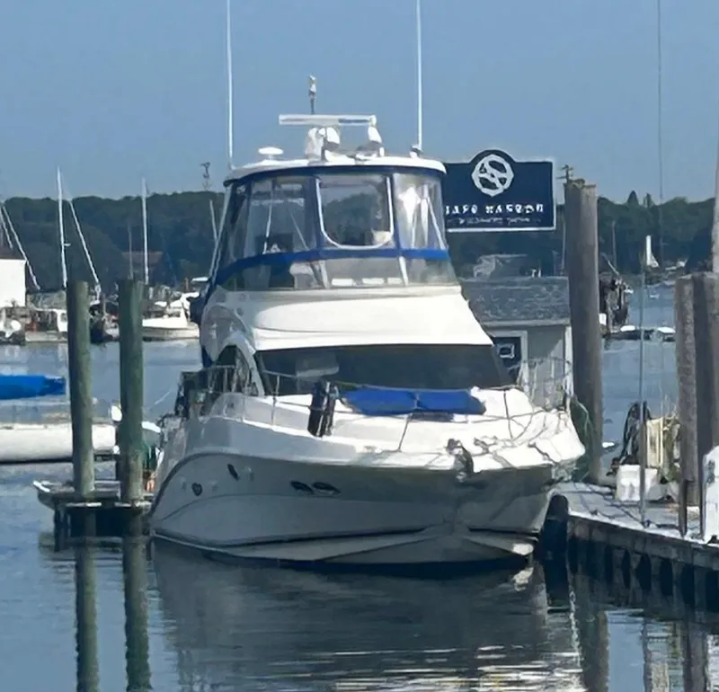 Slide: The Image of 2008 Sea Ray 47 Sedan Bridge yacht docked at a marina. - 0
