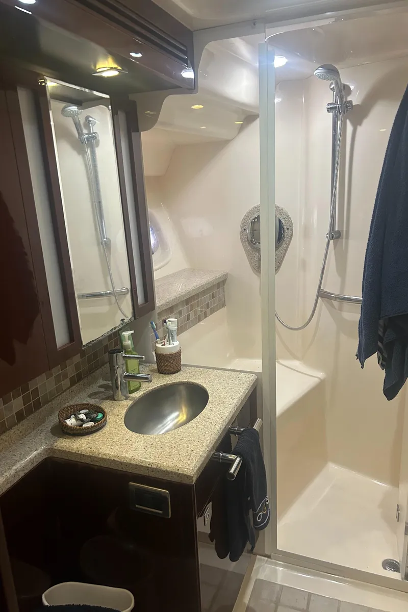 Slide: The Image of Luxurious bathroom in 2008 Sea Ray 47 Sedan Bridge yacht with modern fixtures. - 13