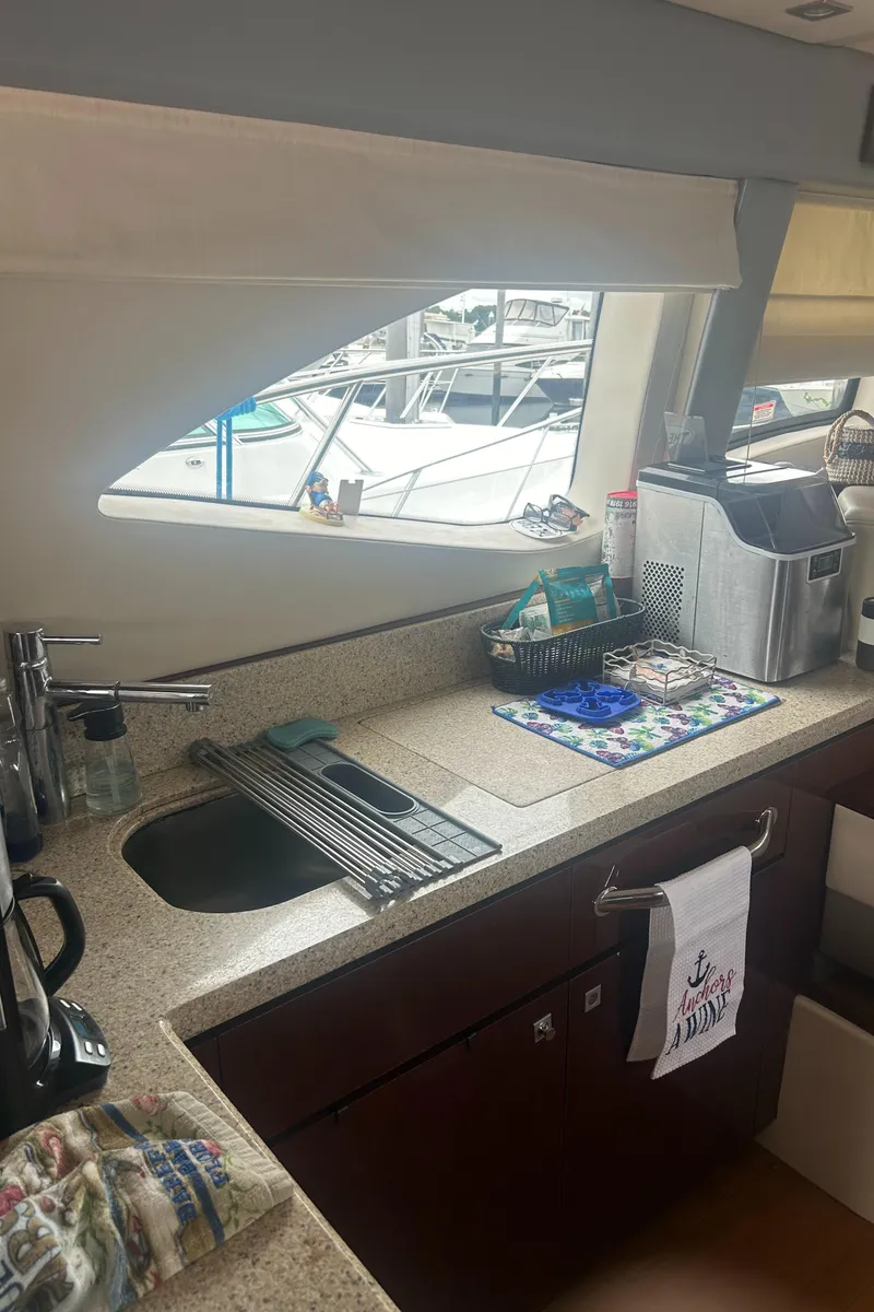 Slide: The Image of 2008 Sea Ray 47 Sedan Bridge yacht kitchen interior with modern amenities. - 23