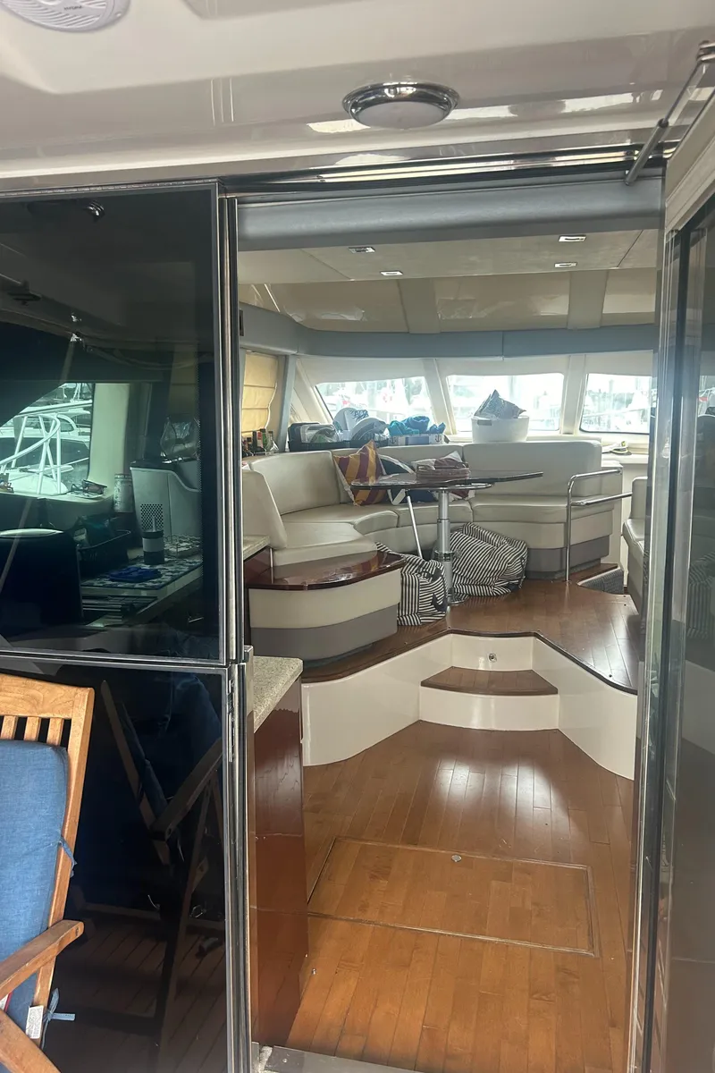 Slide: The Image of Interior view of 2008 Sea Ray 47 Sedan Bridge yacht with elegant seating and wooden flooring. - 24