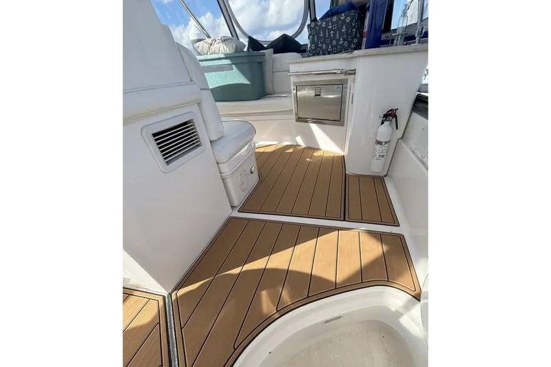 Slide: The Image of 2008 Sea Ray 47 Sedan Bridge interior with teak flooring and modern amenities. - 25