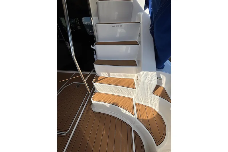 Slide: The Image of Staircase on 2008 Sea Ray 47 Sedan Bridge yacht with teak flooring. - 28