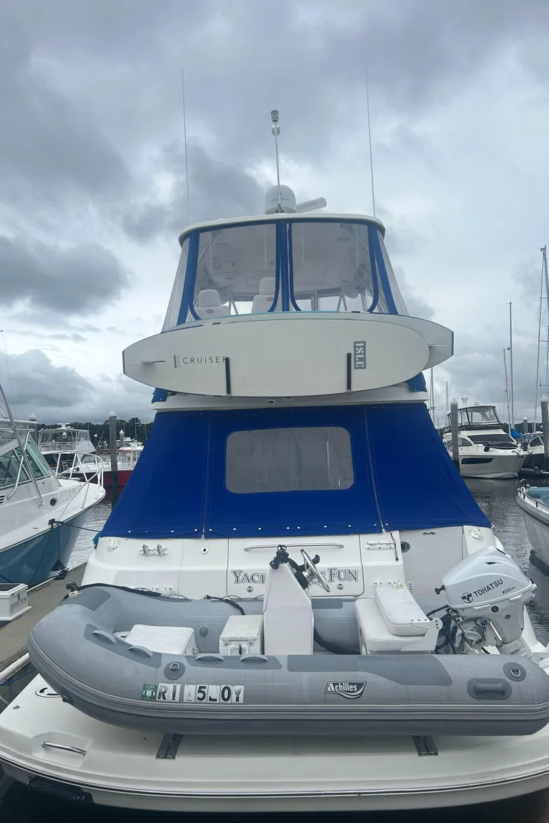 Slide: The Image of 2008 Sea Ray 47 Sedan Bridge yacht docked with inflatable boat. - 7