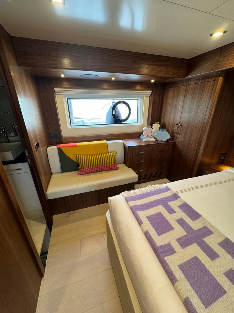 Slide: The Image of Luxurious cabin interior of 2022 Sirena 58 Flybridge yacht with modern wood finishes. - 13