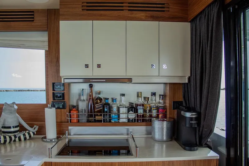 Slide: The Image of Luxury yacht interior with bar setup on Sirena 58 Flybridge, 2022 model. - 14